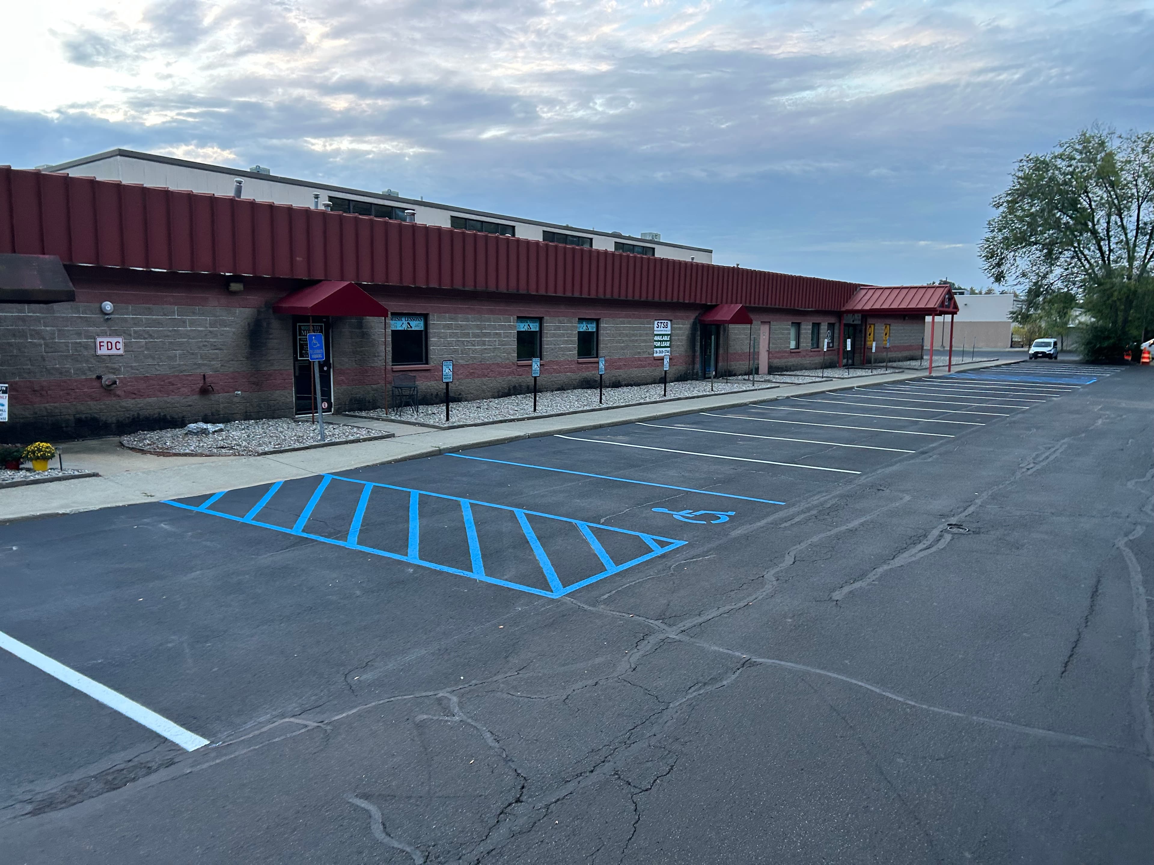 Commercial plaza re-stripe over sealcoat in Clifton Park NY with 7,200 LF of parking lot lines Commercial plaza re-stripe over sealcoat in Clifton Park NY with 7,200 LF of parking lot lines